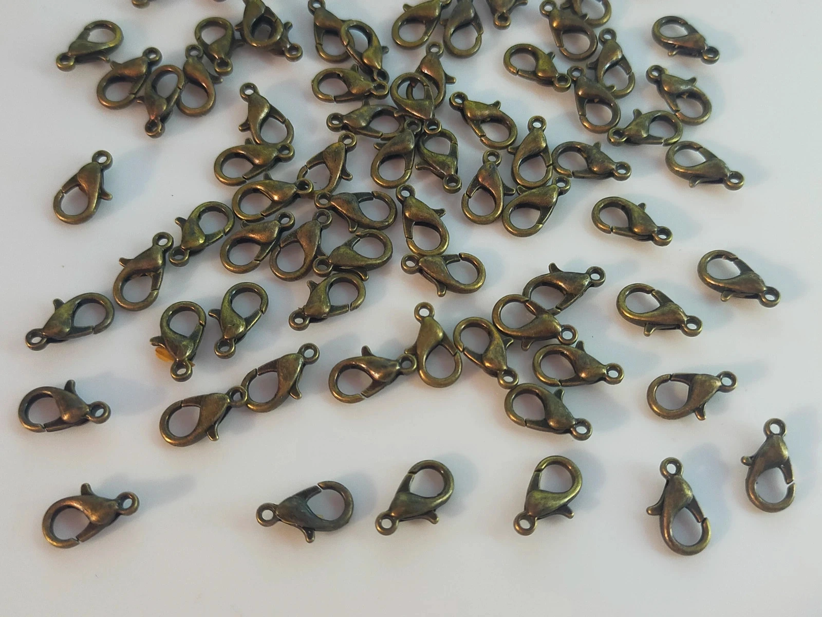 100 karabijnhaakjes 12mm bronzen lot nr. 6004 – photo 3